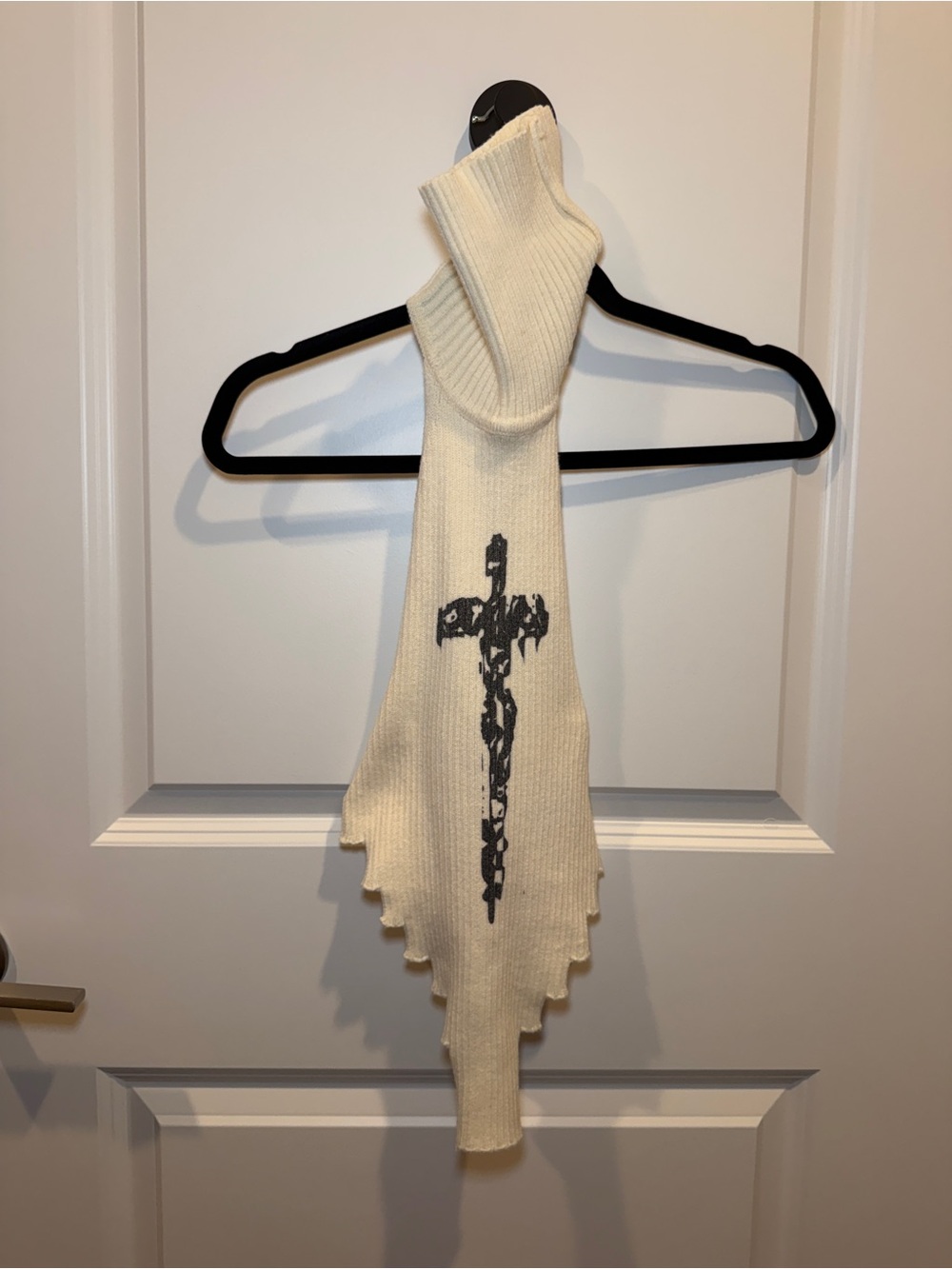 Cream Knit Turtleneck Top with Black Cross Detail